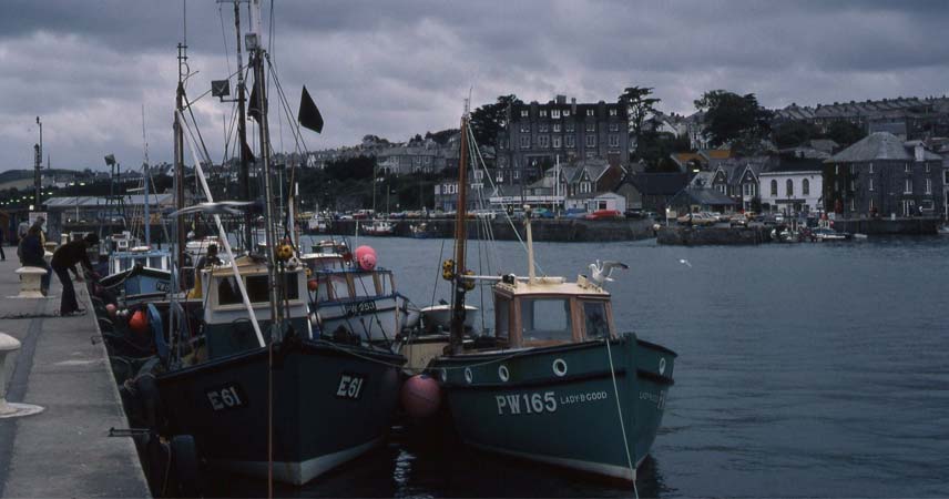 Docked fishing boat in Cornwall on a grey dreary day.