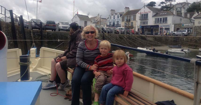 Pat and two children on a boat visiting St Mawes Castle in Cornwall