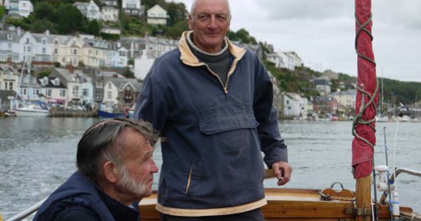 Two fishermen in a small fishing boat in Cornwall