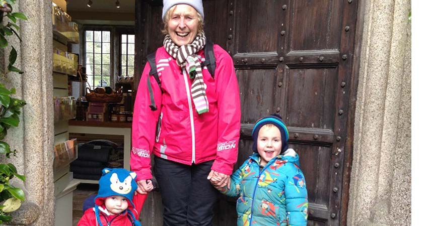 Pat and two children exploring Lanhydrock in Cornwall.