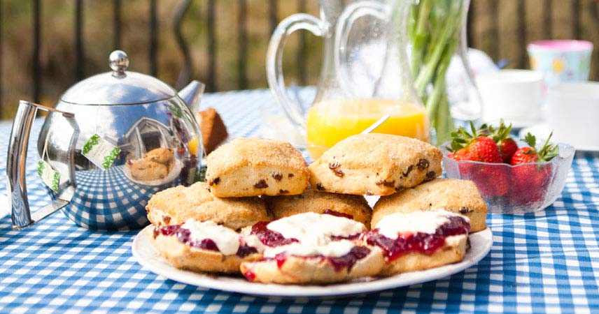 Cream tea, strawberries and orange juice at Bosinver in Cornwall.