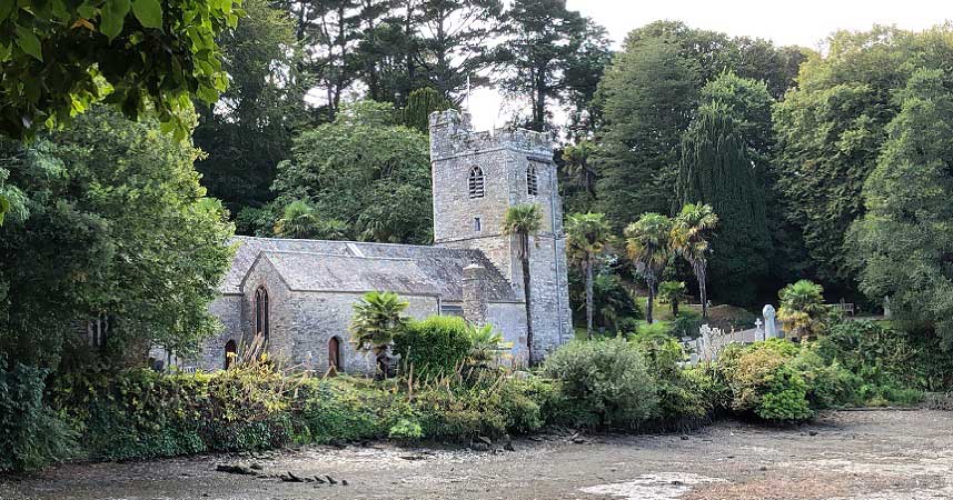 Old church just off the beach surrounded by trees
