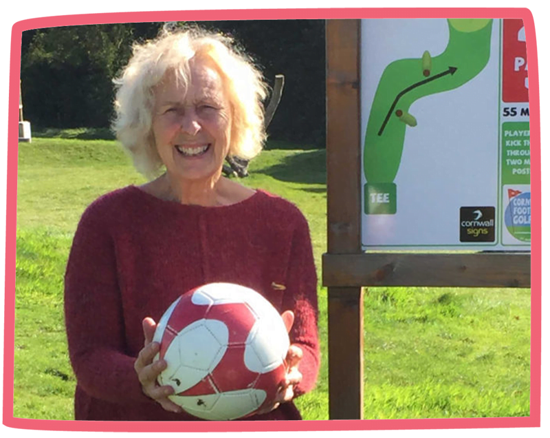 Action Nan Pat from Bosinver holding a football on a sunny day.