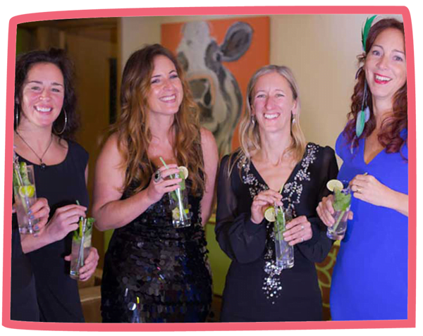 Four women smiling and drinking cocktails at Bosinver