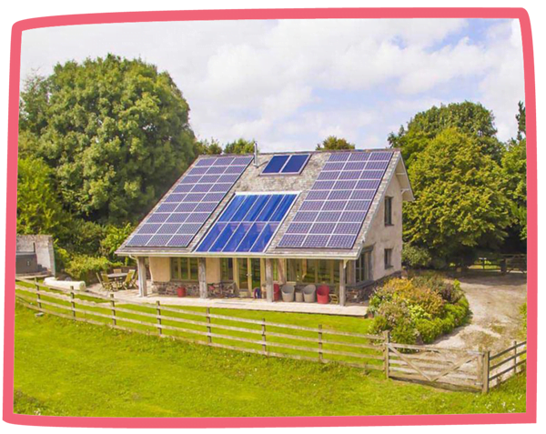 Exterior shot of Lowen cottage at Bosinver, showcasing the solar panels on top of the cottage.