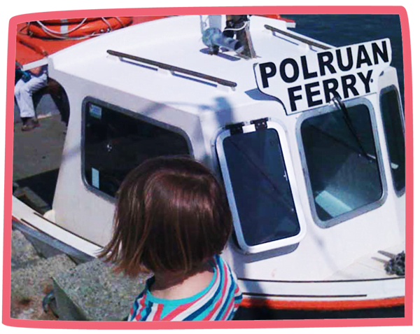 Close up of the Polruan Ferrywith a child in the foreground.
