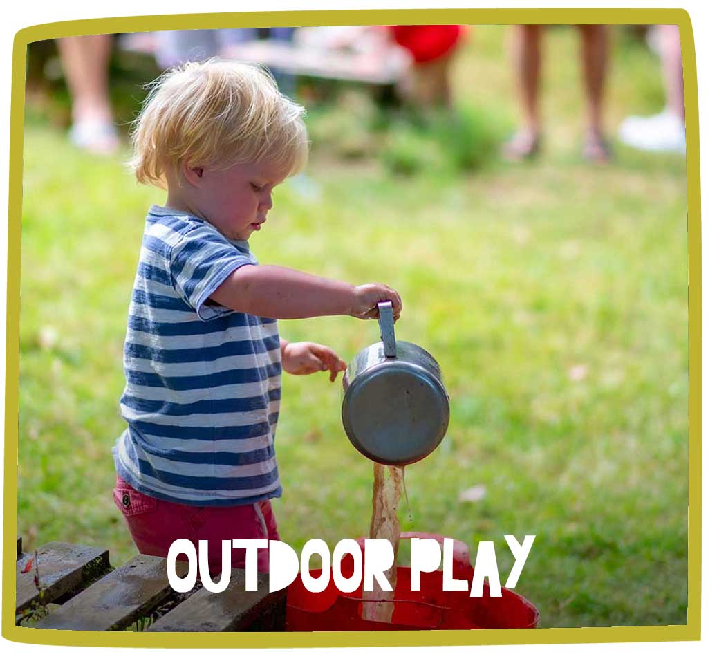 Child pouring mud from a saucepan into a bucket whilst playing in the mud kitchen at Bosinver.
